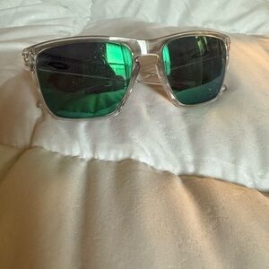 Oakley Clear Frame Sunglasses with Green Mirrored Lenses